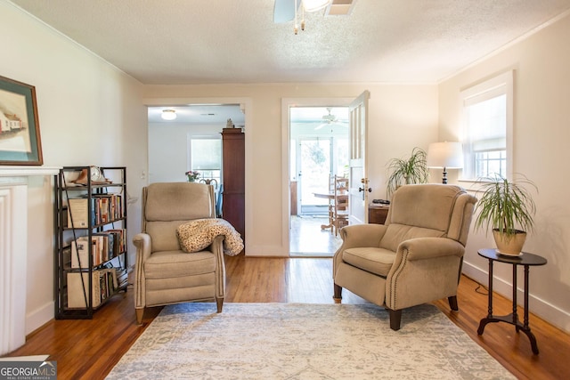 5605 Ga Highway 121, Blackshear, GA 31516 - sitting room with ceiling fan, ornamental molding, wood finished floors, a textured ceiling, and baseboards
