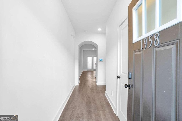 hallway with wood-type flooring