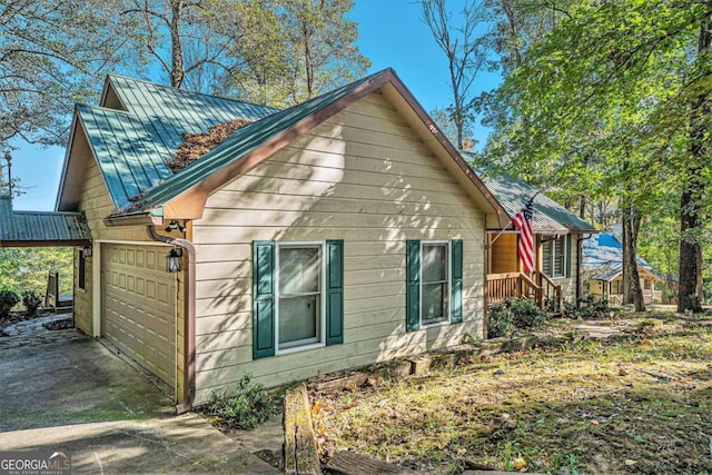 view of property exterior with a garage