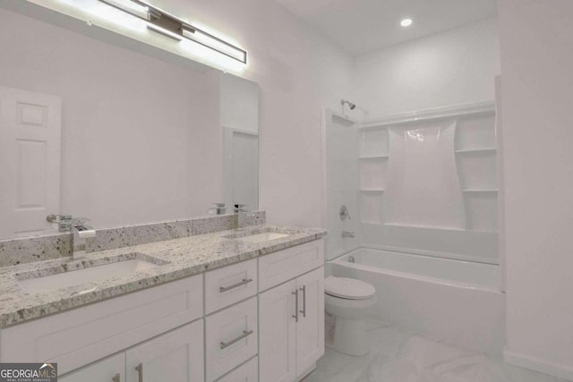 full bathroom with  shower combination, vanity, and toilet