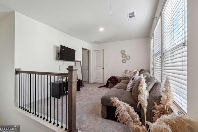 carpeted living room featuring a healthy amount of sunlight