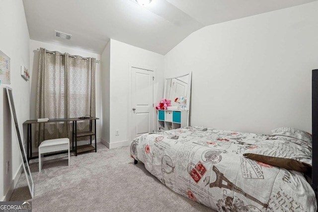 carpeted bedroom featuring lofted ceiling