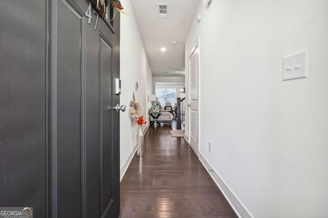 hall with dark hardwood / wood-style floors