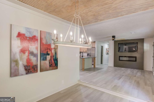 unfurnished dining area with light wood-type flooring