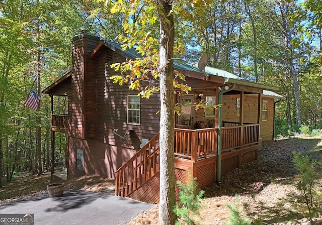 view of side of home featuring a deck