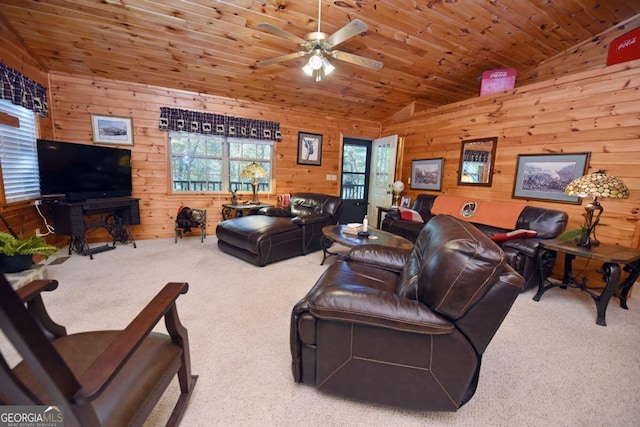 living room with wood ceiling, wooden walls, vaulted ceiling, carpet flooring, and ceiling fan