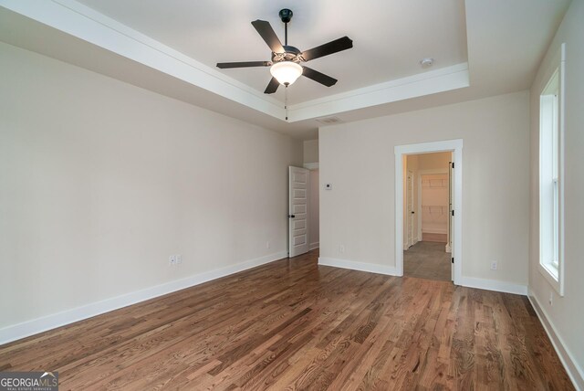 additional living space with an AC wall unit, lofted ceiling, light colored carpet, and plenty of natural light