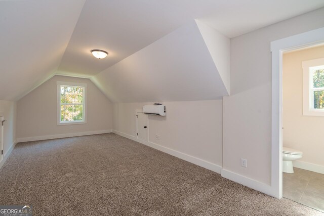 full bathroom featuring vanity, tiled shower / bath, tile patterned floors, and toilet