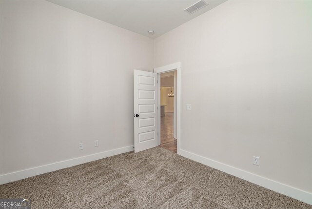 unfurnished bedroom featuring a closet and carpet floors