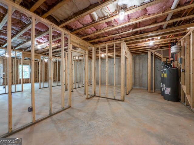 misc room with french doors, concrete flooring, and a healthy amount of sunlight