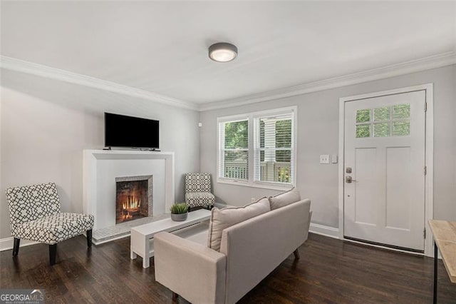 living room with dark wood-type flooring, ornamental molding, and a wealth of natural light