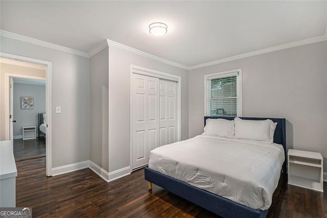 bedroom with ornamental molding, dark hardwood / wood-style floors, and a closet