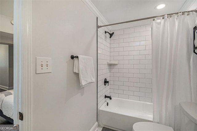 bathroom with crown molding, toilet, and shower / bathtub combination with curtain