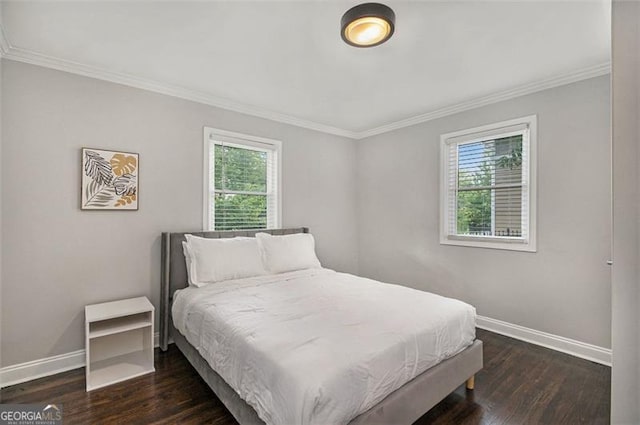 bedroom with ornamental molding, multiple windows, and dark hardwood / wood-style floors