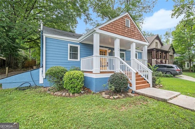 view of front of home featuring a porch and a front lawn