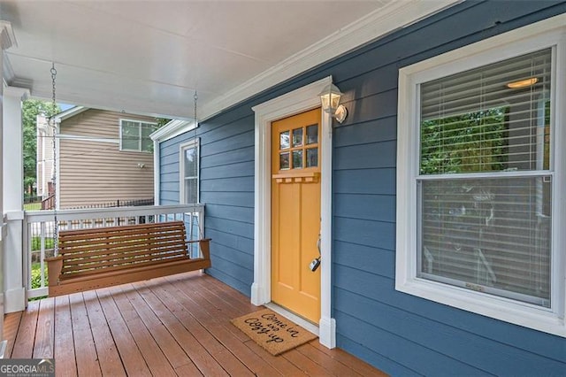 entrance to property featuring a porch