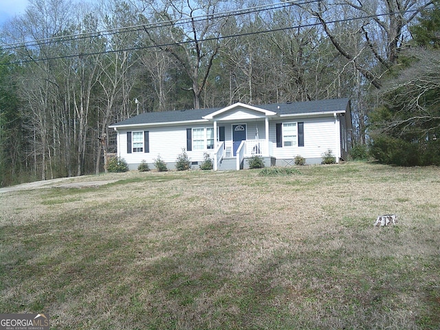 ranch-style house with a front lawn