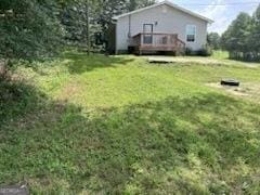 view of yard featuring a wooden deck