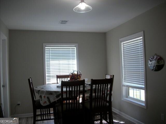 dining area with hardwood / wood-style flooring