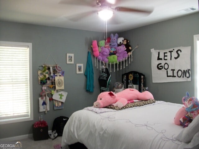 carpeted bedroom with ceiling fan