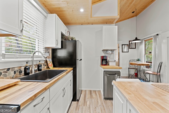 kitchen featuring wooden ceiling, sink, decorative light fixtures, white cabinets, and light wood-type flooring