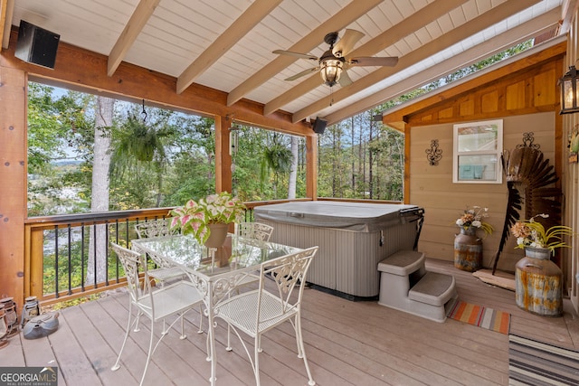 deck featuring a hot tub and ceiling fan