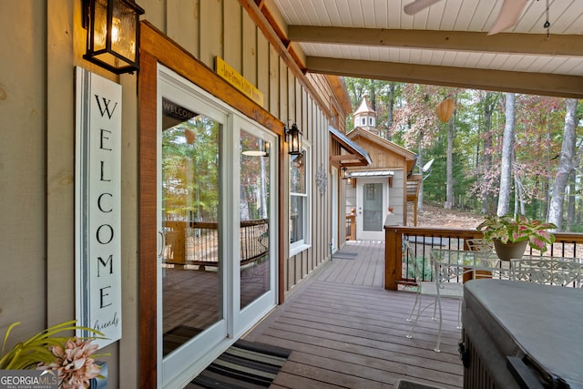 deck featuring a hot tub