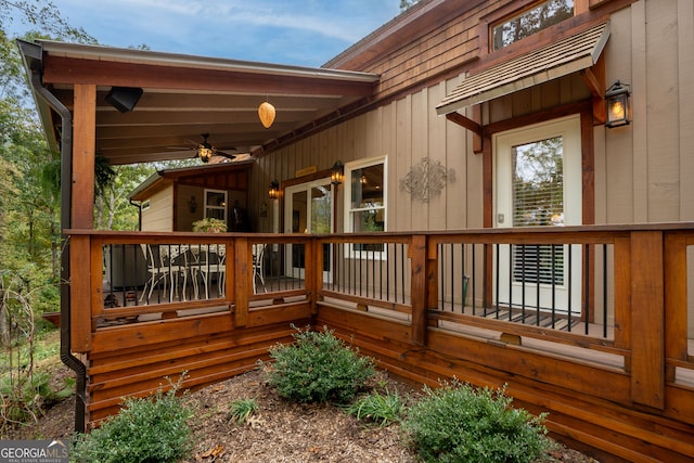 wooden terrace featuring ceiling fan