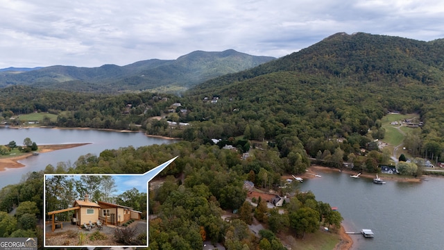 exterior space with a water and mountain view