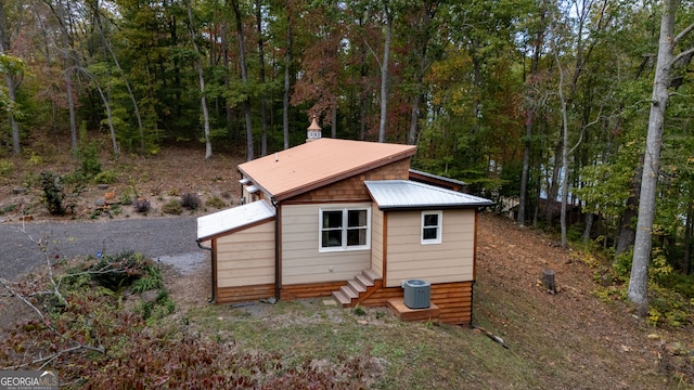 back of property with central AC unit