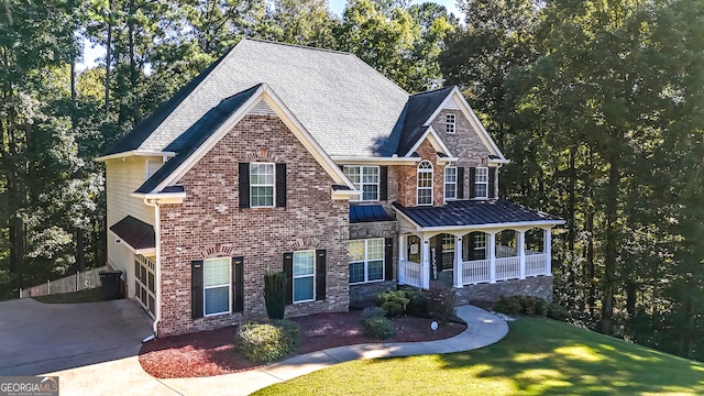 view of front of house featuring a garage and a front lawn