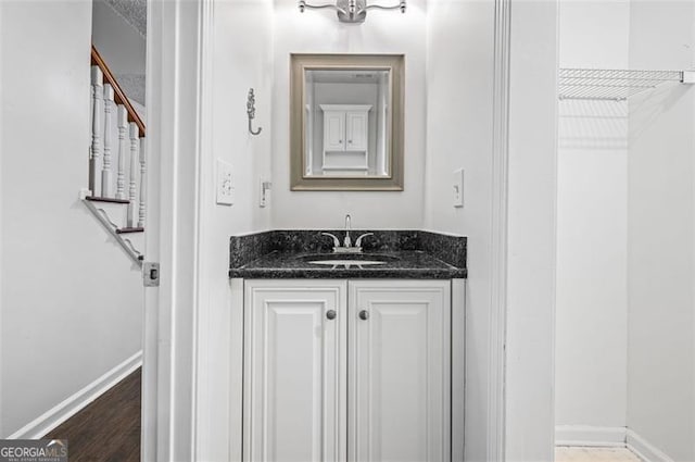 bathroom featuring vanity and wood-type flooring