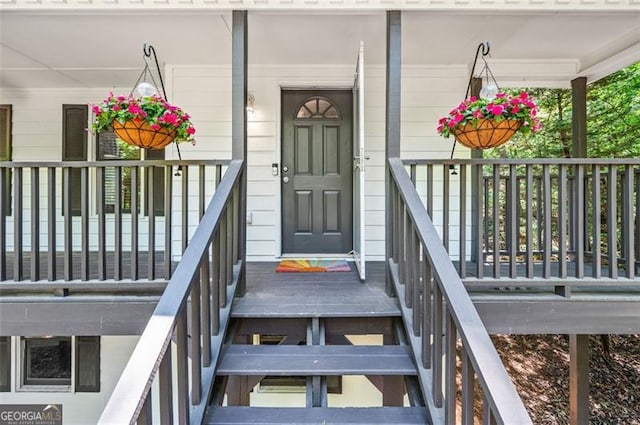 doorway to property with a porch