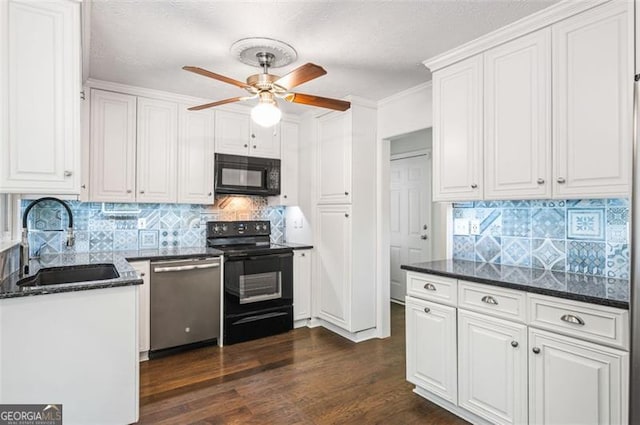 kitchen featuring decorative backsplash, dark hardwood / wood-style flooring, white cabinetry, black appliances, and sink