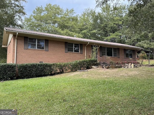 ranch-style house featuring a front lawn