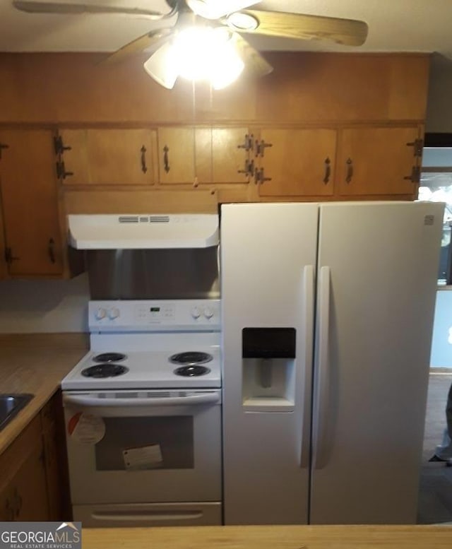 kitchen featuring white range with electric cooktop, ceiling fan, sink, stainless steel fridge with ice dispenser, and exhaust hood