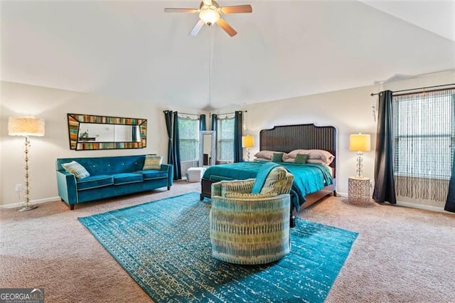 bedroom featuring carpet flooring, vaulted ceiling, and ceiling fan