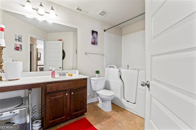 full bathroom with vanity, toilet, and washtub / shower combination