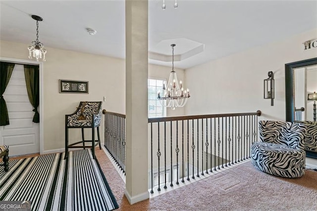 corridor with carpet and a chandelier