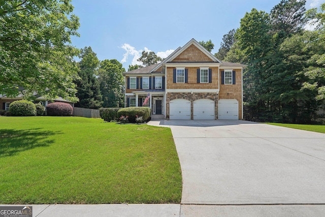 view of front of house with a garage and a front lawn