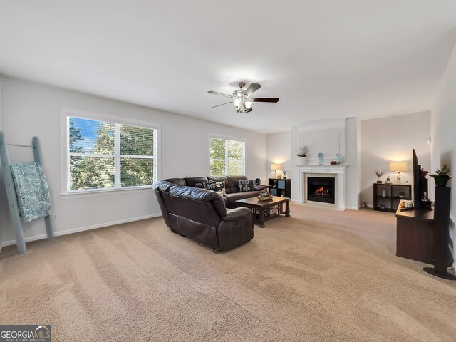 living room with ceiling fan and light carpet