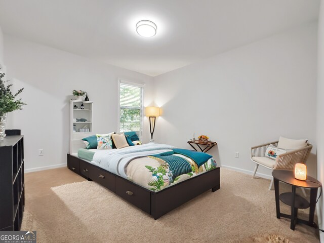 bedroom featuring light colored carpet