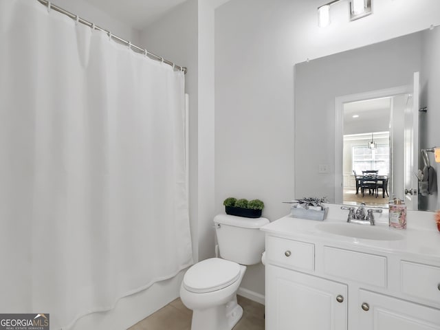 bathroom featuring toilet and vanity