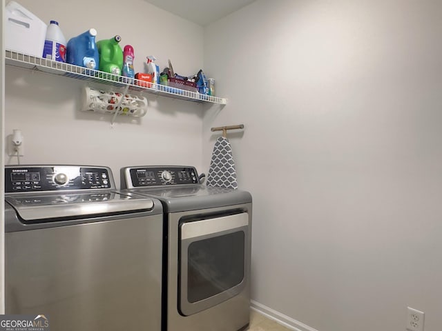 clothes washing area featuring washer and dryer