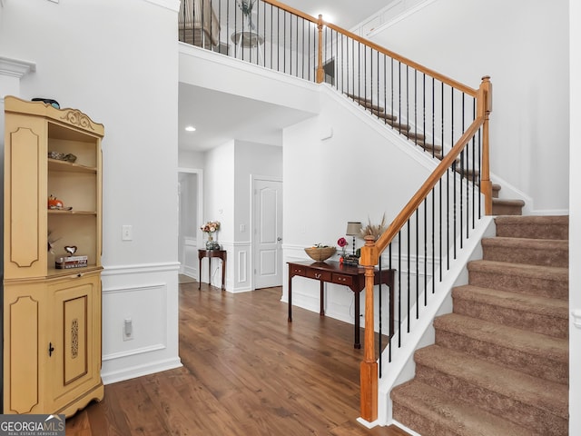 stairway featuring hardwood / wood-style floors