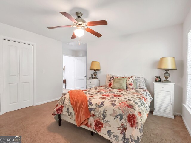 bedroom with ceiling fan, a closet, light carpet, and multiple windows