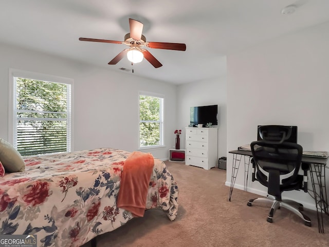 carpeted bedroom with ceiling fan