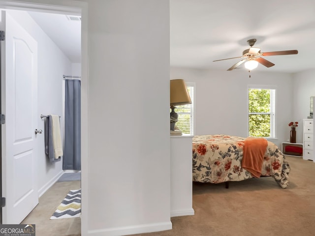 carpeted bedroom with ceiling fan