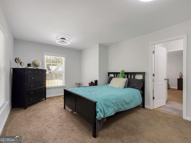 bedroom with light colored carpet