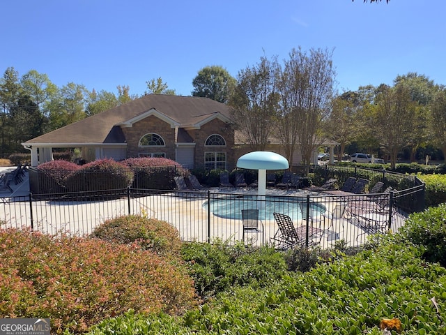 view of pool featuring a patio